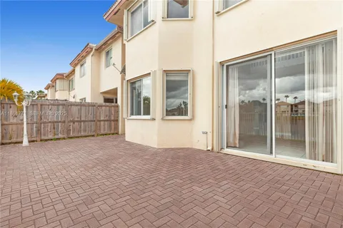 a view of a entrance gate of a building with a street