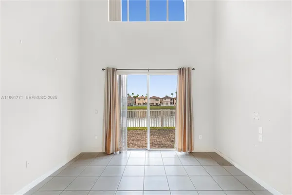a view of an empty room and window