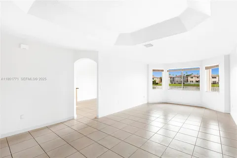 a view of an empty room and window