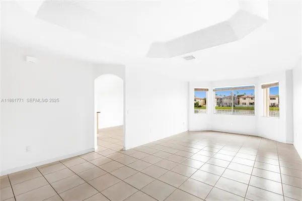 a view of an empty room and window