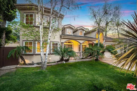 a view of a house with a swimming pool