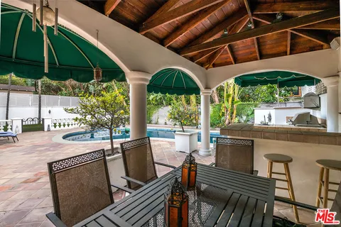 a front view of a house with swimming pool