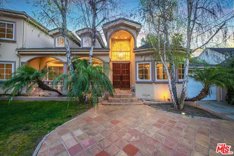 a house view with a garden space