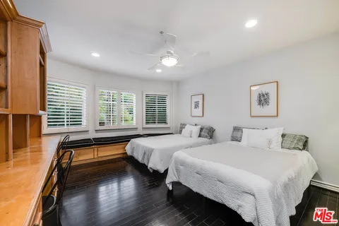a bedroom with a bed and a table in it