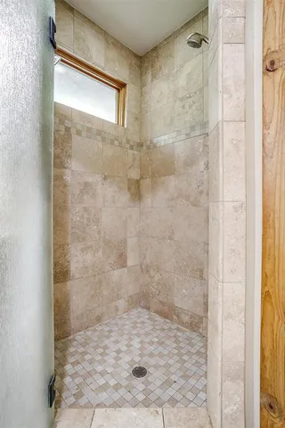 a bedroom with a bed and cabinets