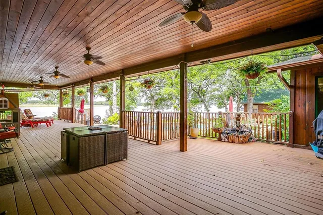 a view of a living room and wooden deck