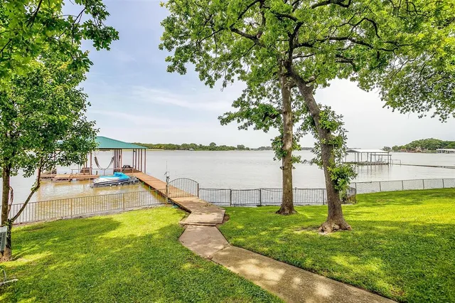 a view of a terrace with a garden and deck