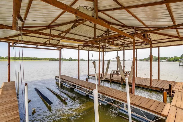 a view of a balcony with wooden floor