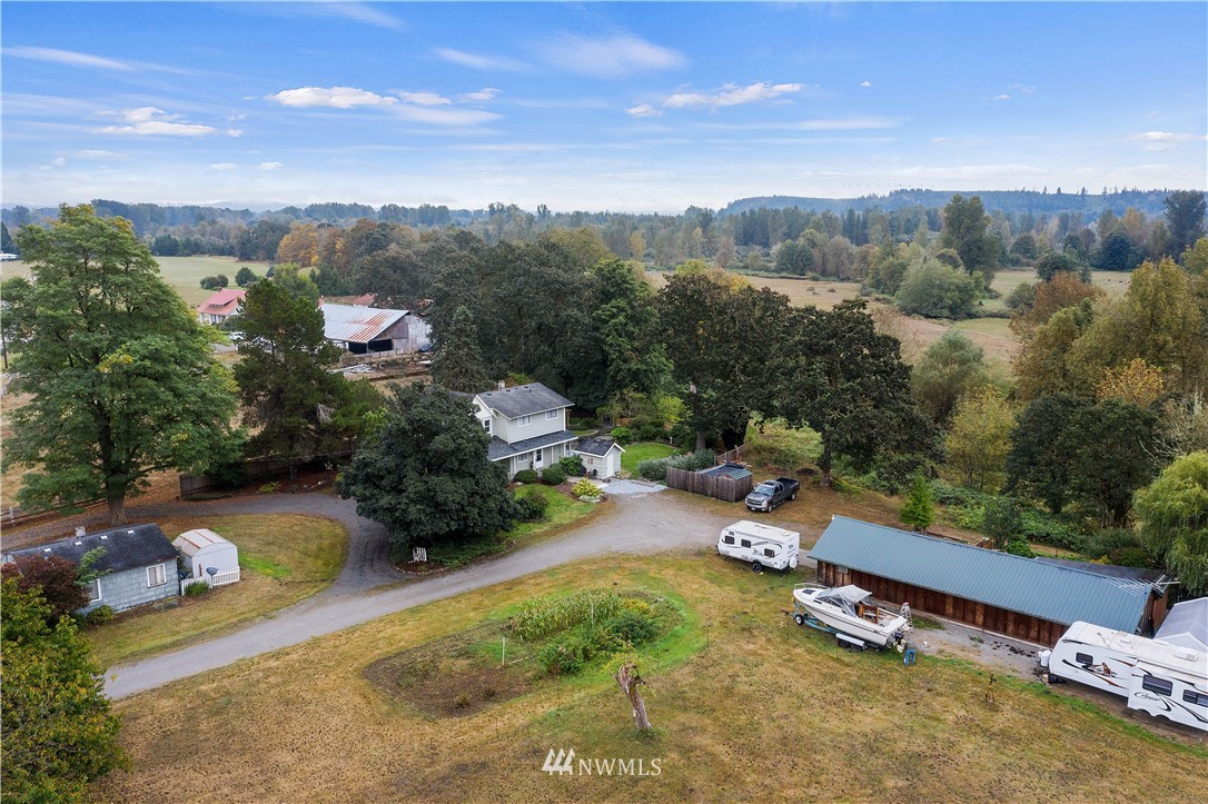 8123 James Road Southwest Rochester, WA 98579 - Photo 1 of 38 an aerial view of a garden with mountain