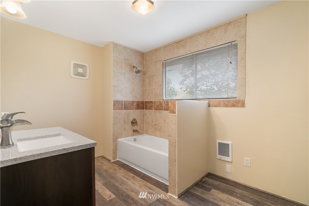 8123 James Road Southwest Rochester, WA 98579 - Photo 14 of 38 a bathroom with a sink and a mirror