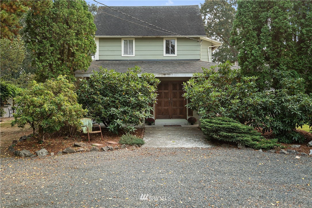 8123 James Road Southwest Rochester, WA 98579 - Photo 5 of 38 front view of a house with a plants and trees