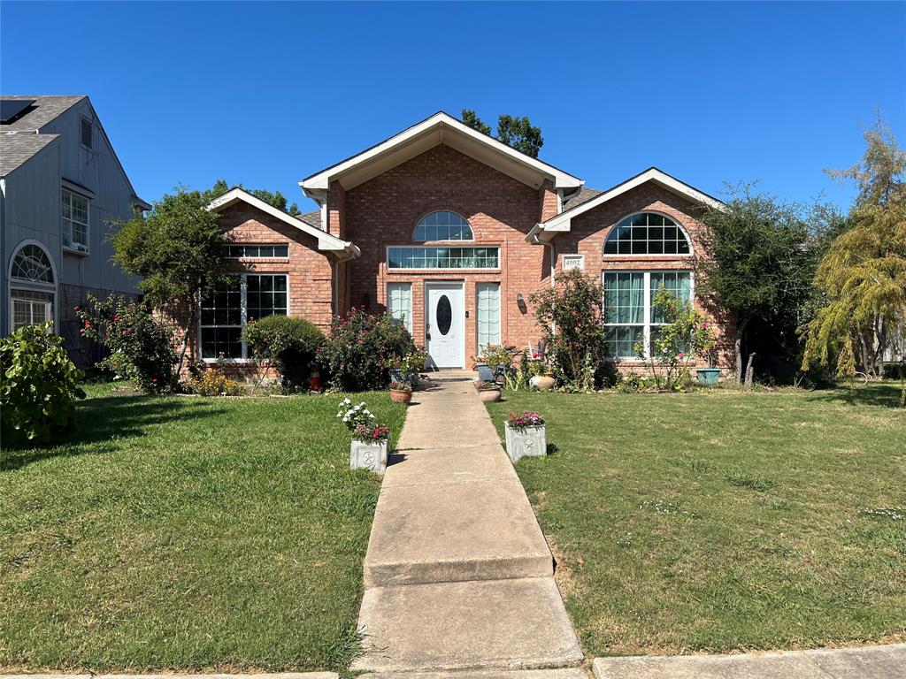 4002 Tropic Lane Rowlett, TX 75088 - Photo 1 of 1 a front view of a house with a yard