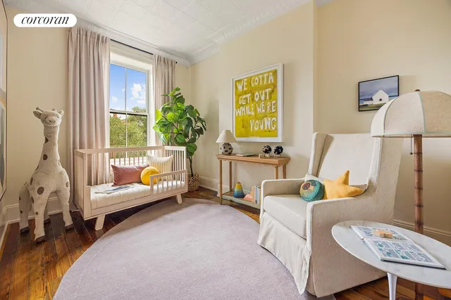 a bedroom with furniture and a window