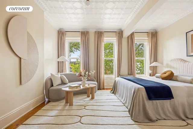 a kitchen with granite countertop white cabinets and stainless steel appliances