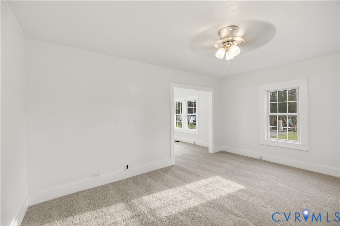 239 Brunswick Road Emporia, VA 23847 - Photo 3 of 22 Carpeted living room featuring white walls and tri