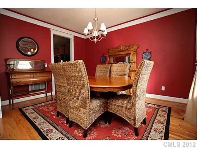 213 Mills Lane Fort Mill, SC 29708 - Photo 2 of 16 a dining room with furniture and chandelier