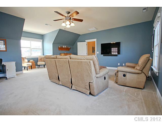 213 Mills Lane Fort Mill, SC 29708 - Photo 12 of 16 a living room with furniture and a flat screen tv