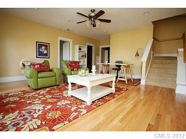 213 Mills Lane Fort Mill, SC 29708 - Photo 13 of 16 a living room with patio furniture and a wooden floor