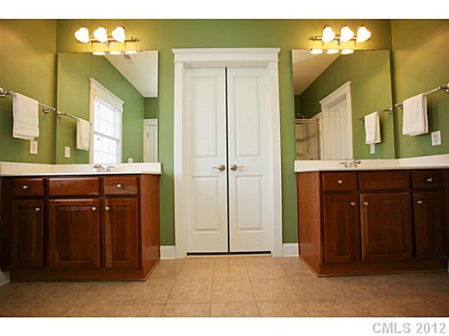 213 Mills Lane Fort Mill, SC 29708 - Photo 8 of 16 a bathroom with a sink and a mirror