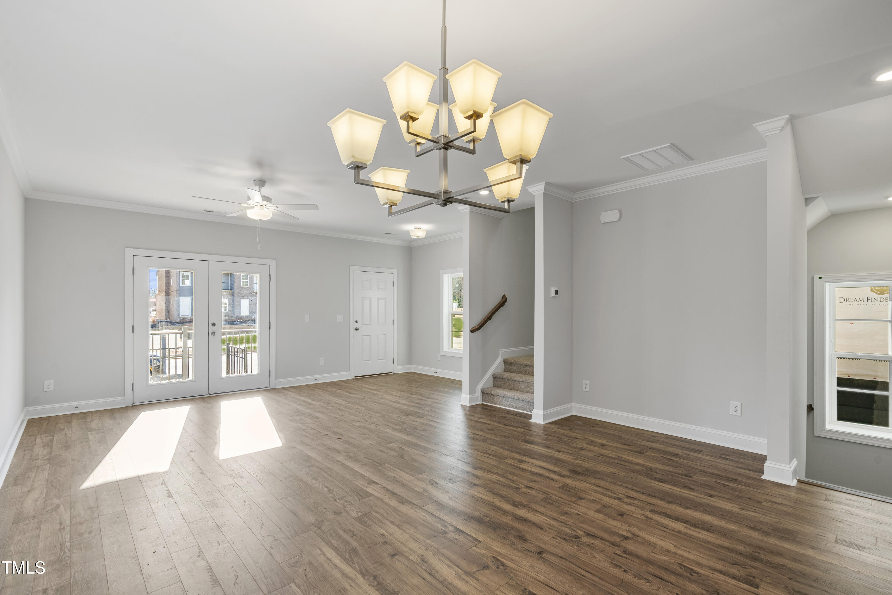 527 Forestville Road Wake Forest, NC 27587 - Photo 26 of 47 a view of an empty room with wooden floor and a window