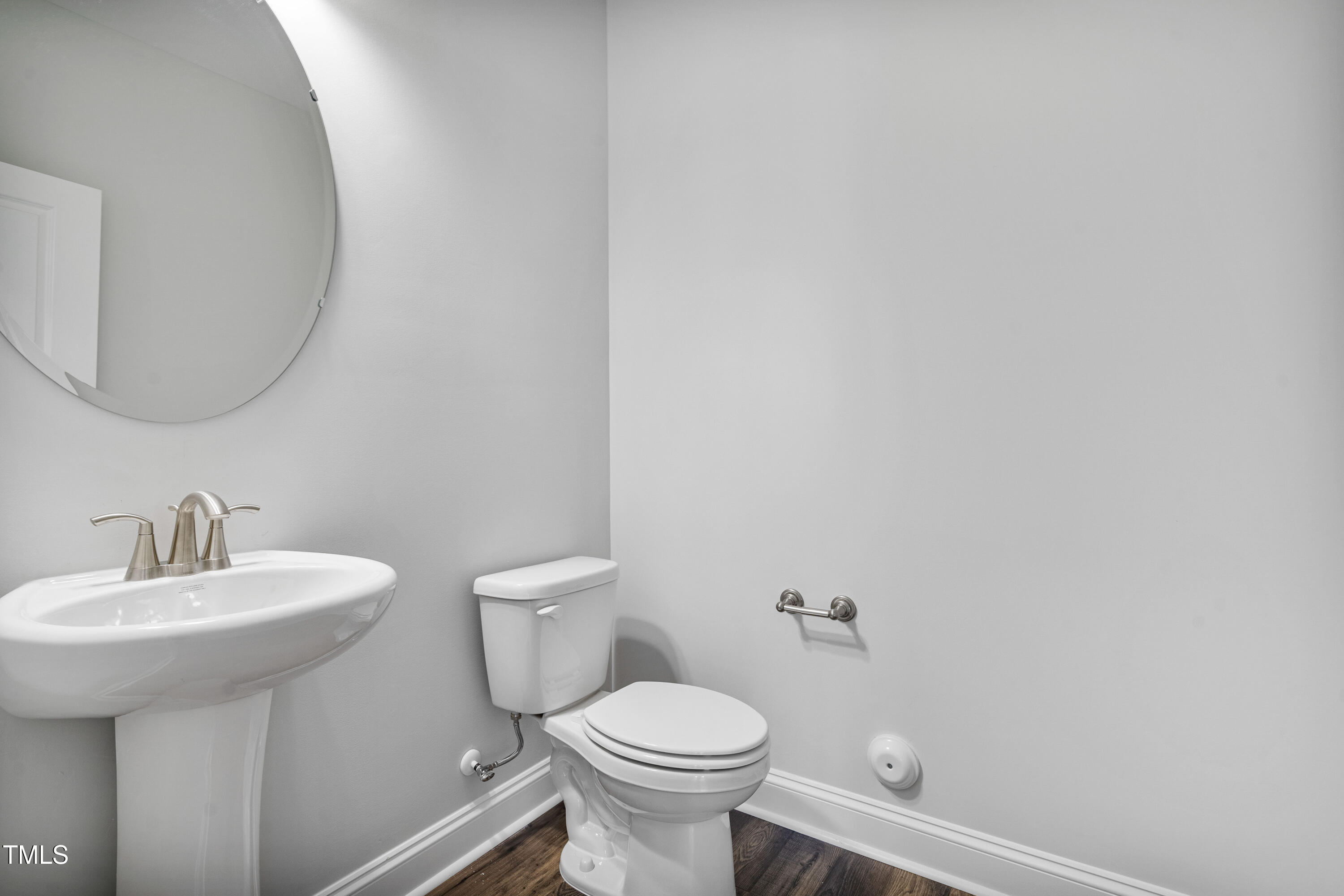 527 Forestville Road Wake Forest, NC 27587 - Photo 34 of 47 a bathroom with a toilet sink and mirror