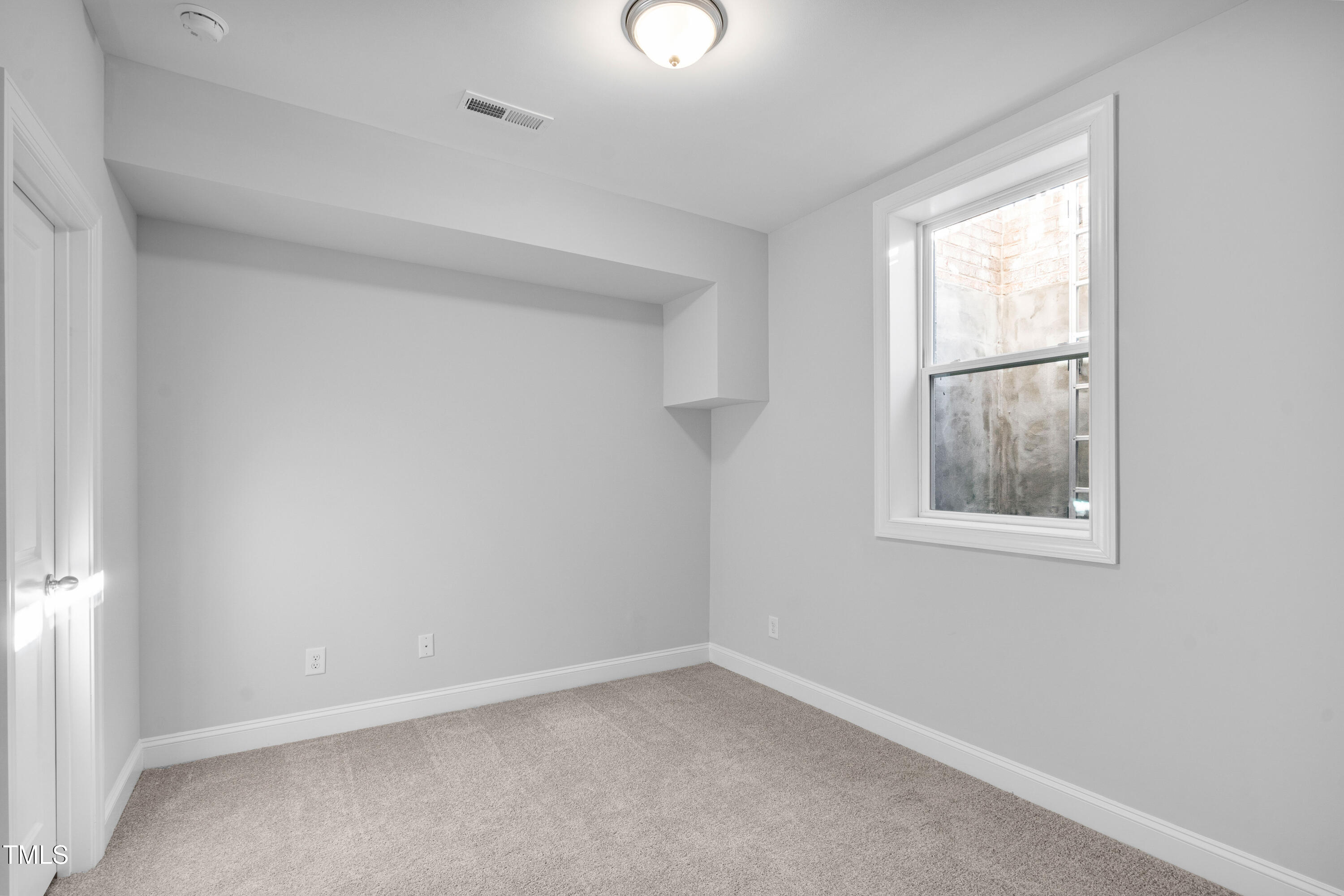 527 Forestville Road Wake Forest, NC 27587 - Photo 36 of 47 an empty room with a window