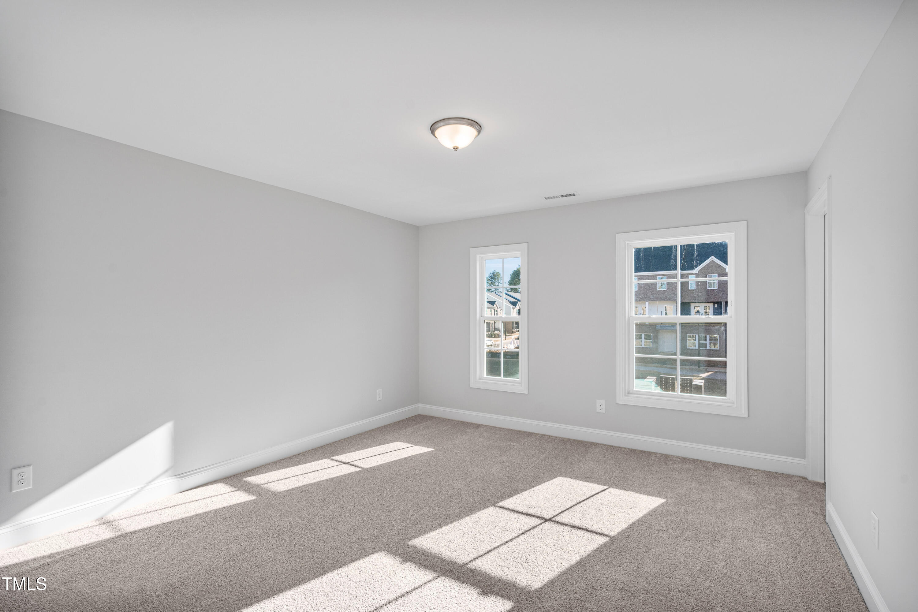 527 Forestville Road Wake Forest, NC 27587 - Photo 40 of 47 a view of an empty room with a window