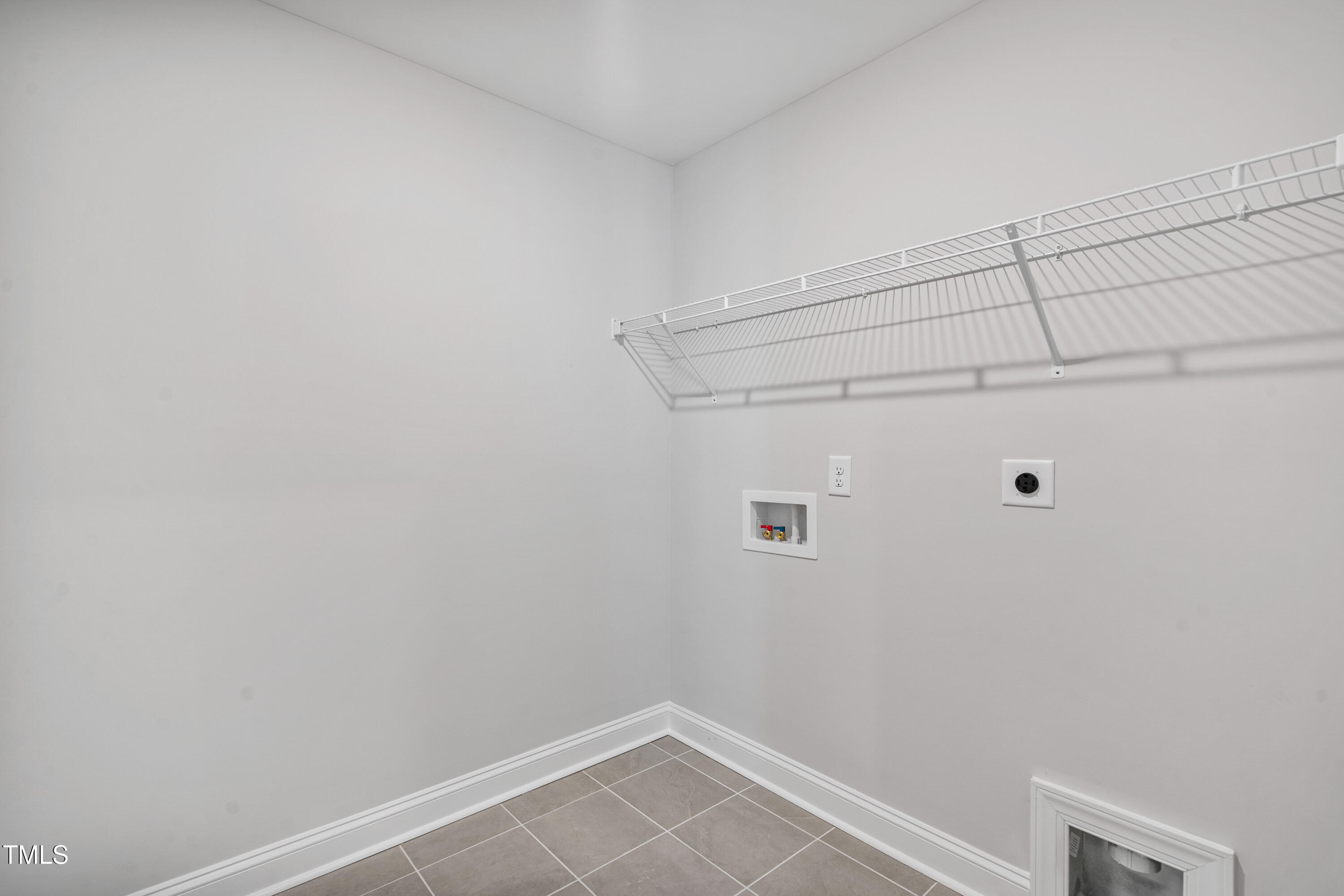 527 Forestville Road Wake Forest, NC 27587 - Photo 43 of 47 a view of a room with racks on the wall