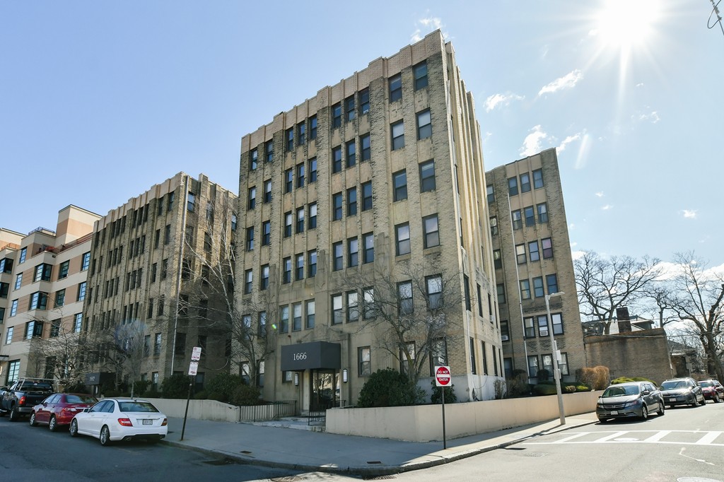 1666 Commonwealth Avenue, Unit 33 Boston, MA 02135 - Photo 11 of 11 a city street lined with buildings and cars