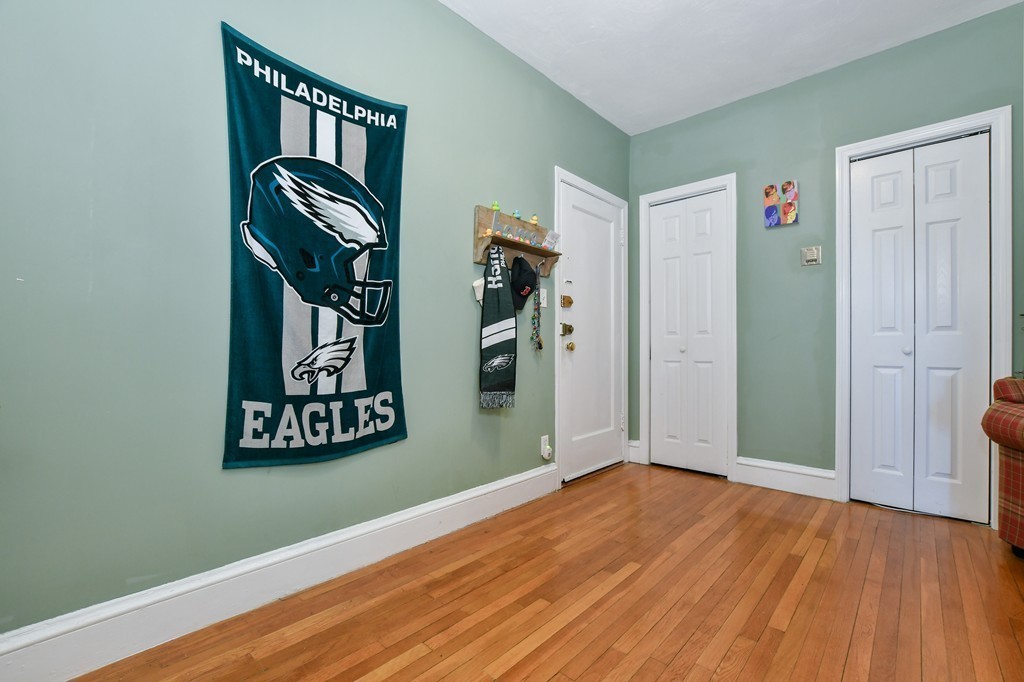1666 Commonwealth Avenue, Unit 33 Boston, MA 02135 - Photo 3 of 11 a view of front door with wooden floor