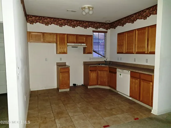a view of a kitchen with electric appliances