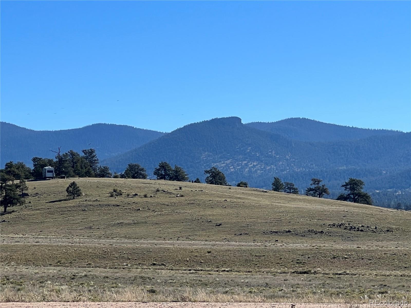 1348 Apache Trail Hartsel, CO 80449 - Photo 17 of 38 a view of a dry field with mountains in the background