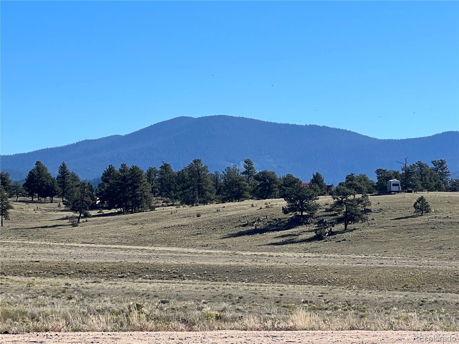 1348 Apache Trail Hartsel, CO 80449 - Photo 18 of 38 a view of a town with mountains in the background