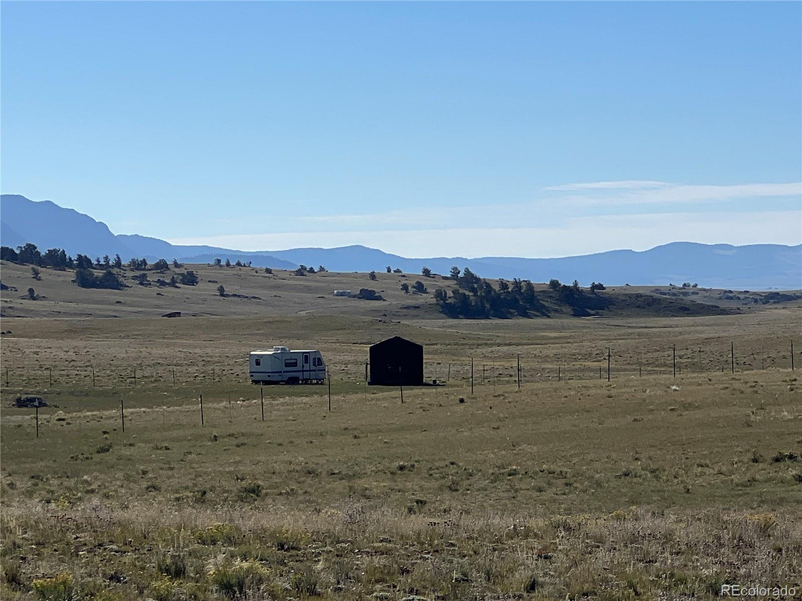 1348 Apache Trail Hartsel, CO 80449 - Photo 3 of 38 a view of a lake with mountains in the background