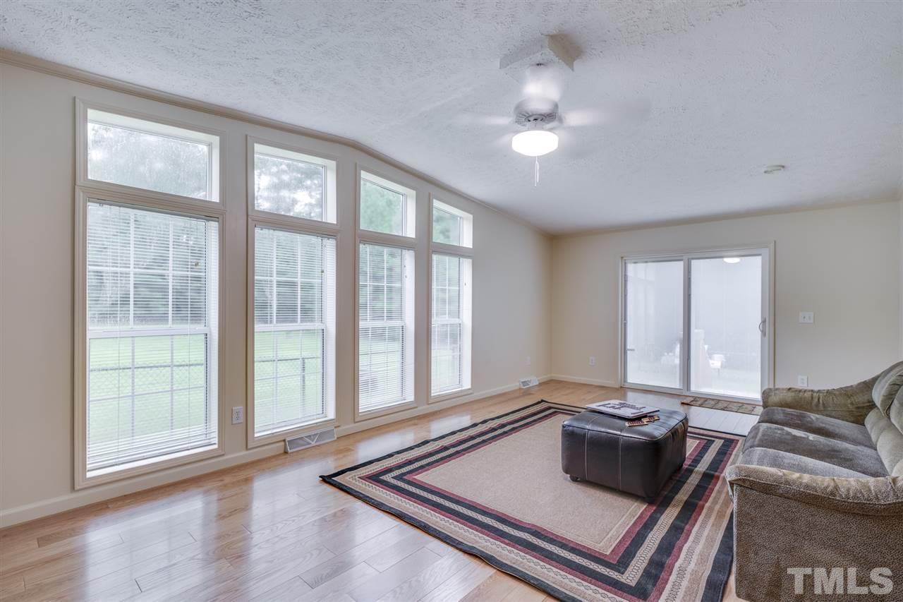 3089 Rock Spring Church Road Creedmoor, NC 27522 - Photo 20 of 30 Beautiful Family Room featuring 3/4" hardwoods. Lots of windows overlooking back yard