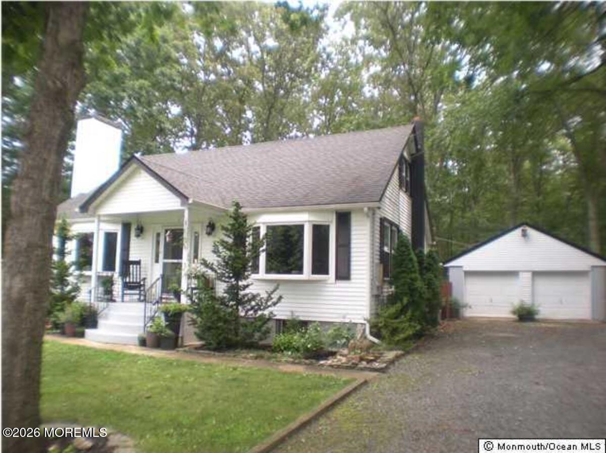645-651 Brewers Bridge Road Jackson, NJ 08527 - Photo 4 of 4 a front view of a house with a yard and porch