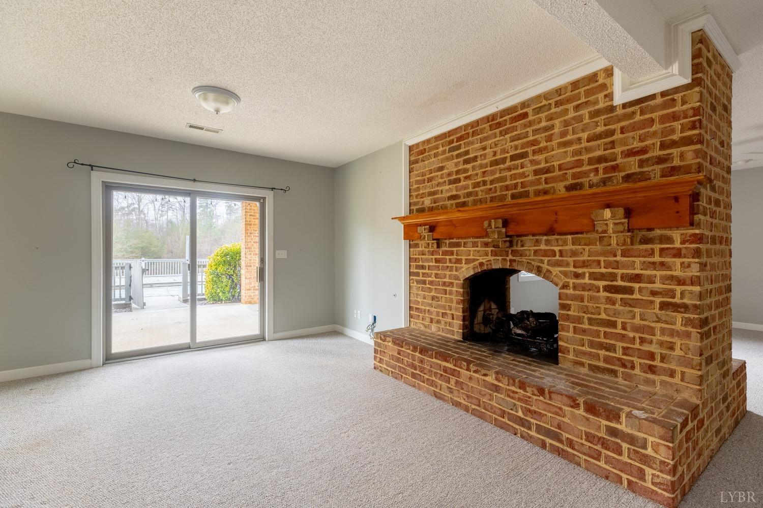4654 Roaring Run Road Goode, VA 24556 - Photo 49 of 73 a living room with a fireplace