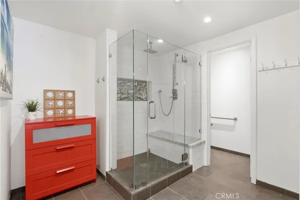 a bathroom with a shower and a sink