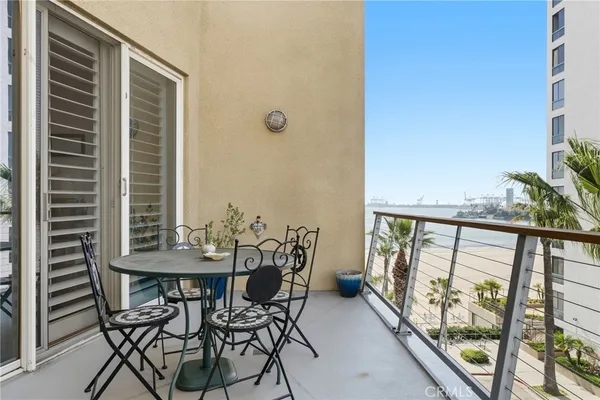 a view of balcony with furniture and wooden deck