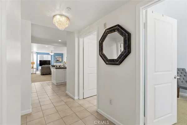 a view of a hallway with seating area