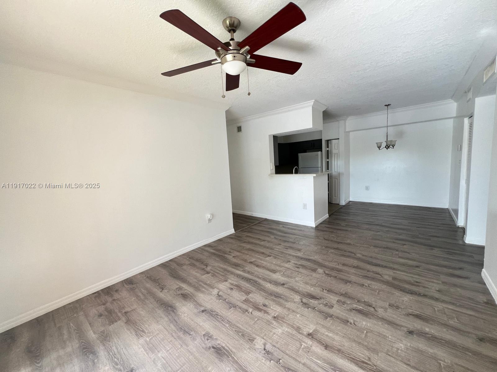 101 Southwest 117th Avenue, Unit 7206 Pembroke Pines, FL 33025 - Photo 4 of 12 wooden floor in an empty room