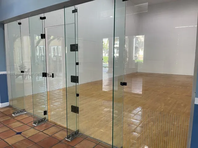 a bathroom with a shower and a sink