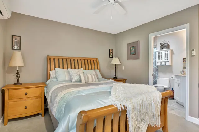 a bedroom with a bed and a cabinets