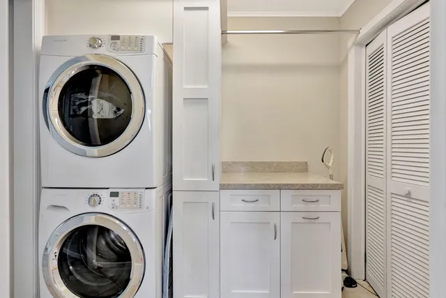 a view of a hallway with washer and dryer