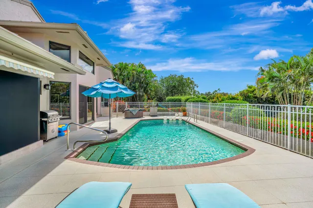 a view of a swimming pool with a patio