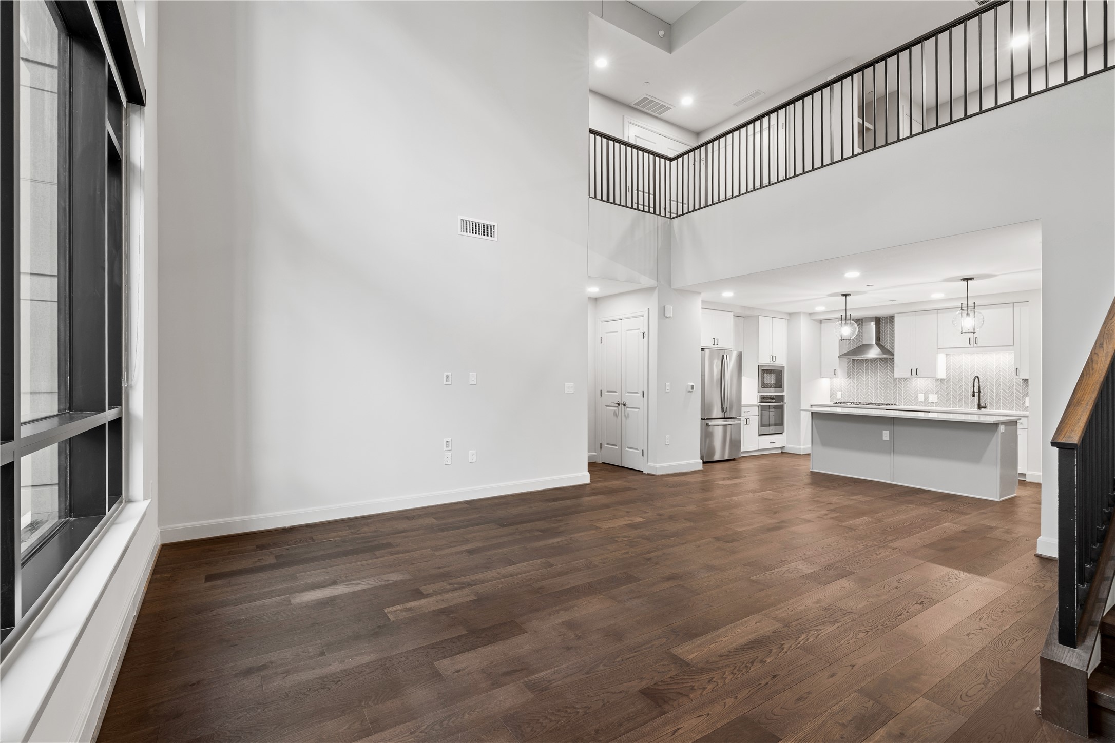2511 Willowick Road, Unit 117 Houston, TX 77027 - Photo 11 of 43 a view of a kitchen with wooden floor and a sink