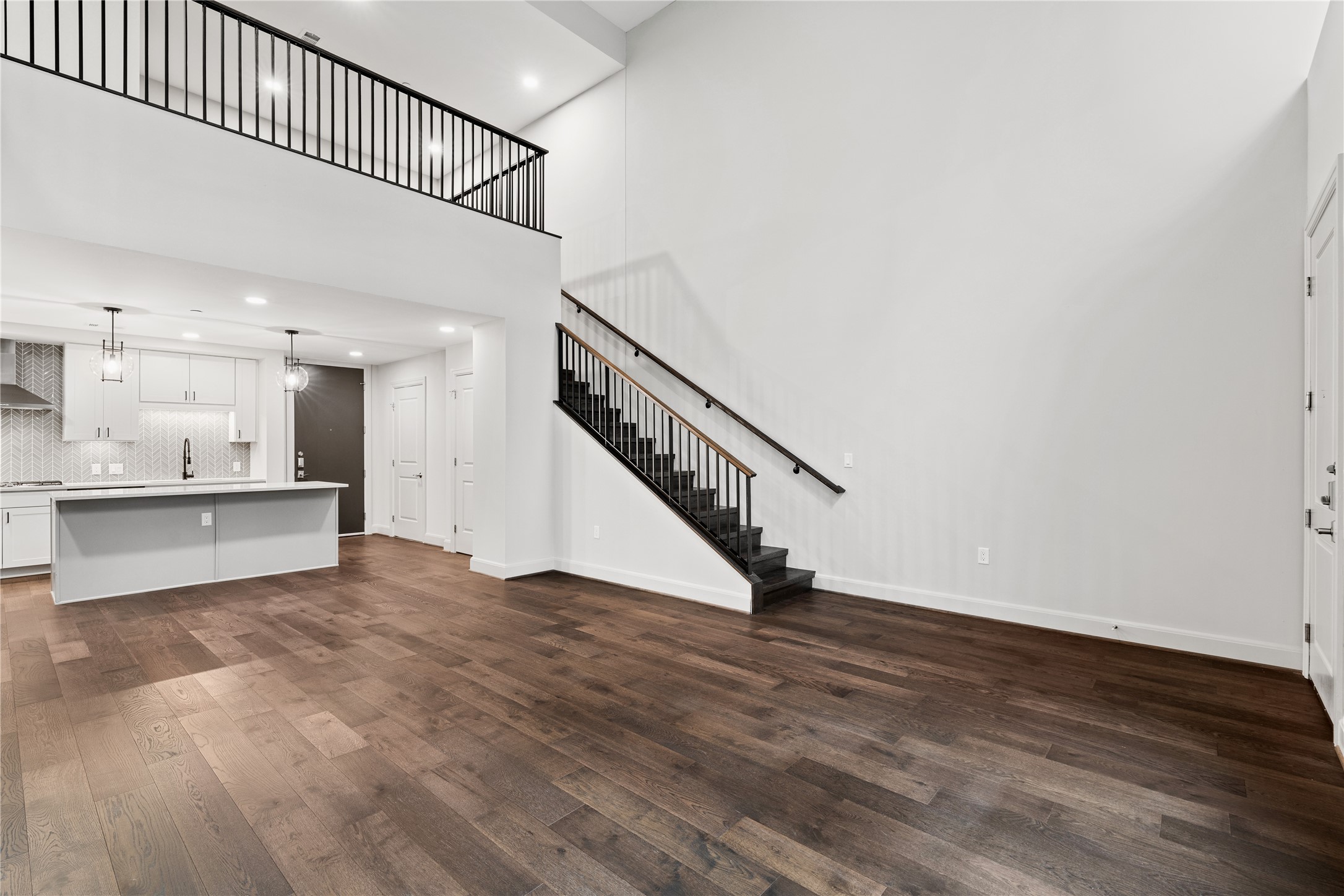 2511 Willowick Road, Unit 117 Houston, TX 77027 - Photo 12 of 43 a view of an empty room with wooden floor