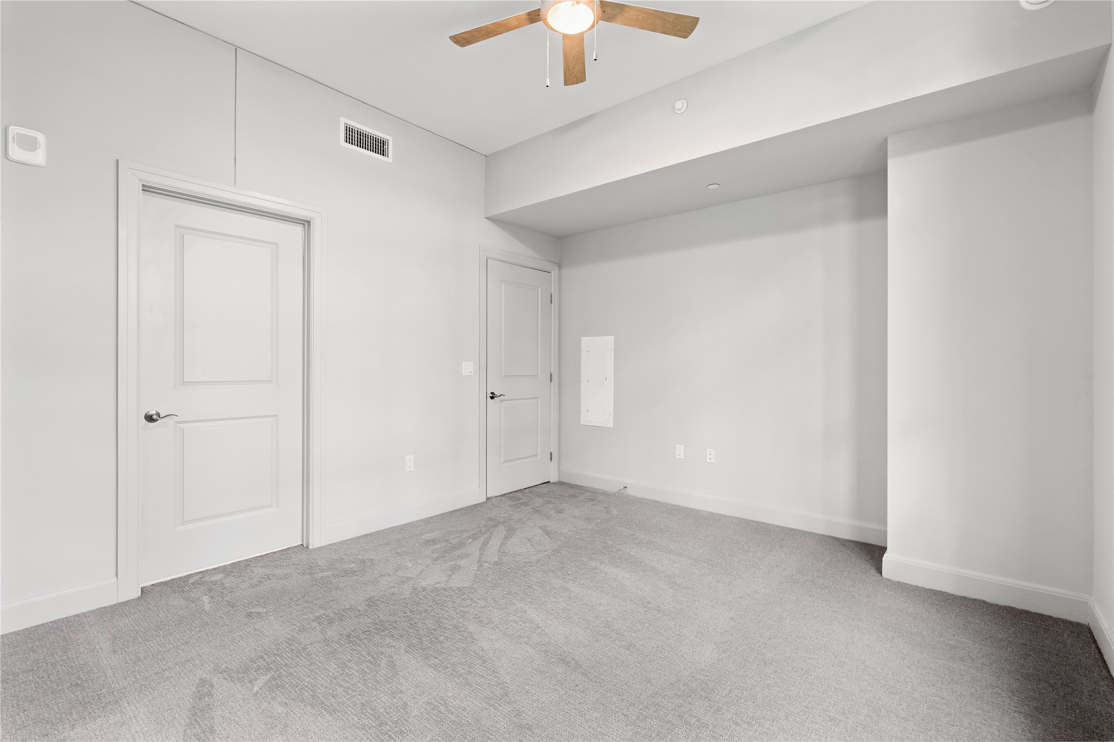 2511 Willowick Road, Unit 117 Houston, TX 77027 - Photo 16 of 43 an empty room with a chandelier fan and closet area