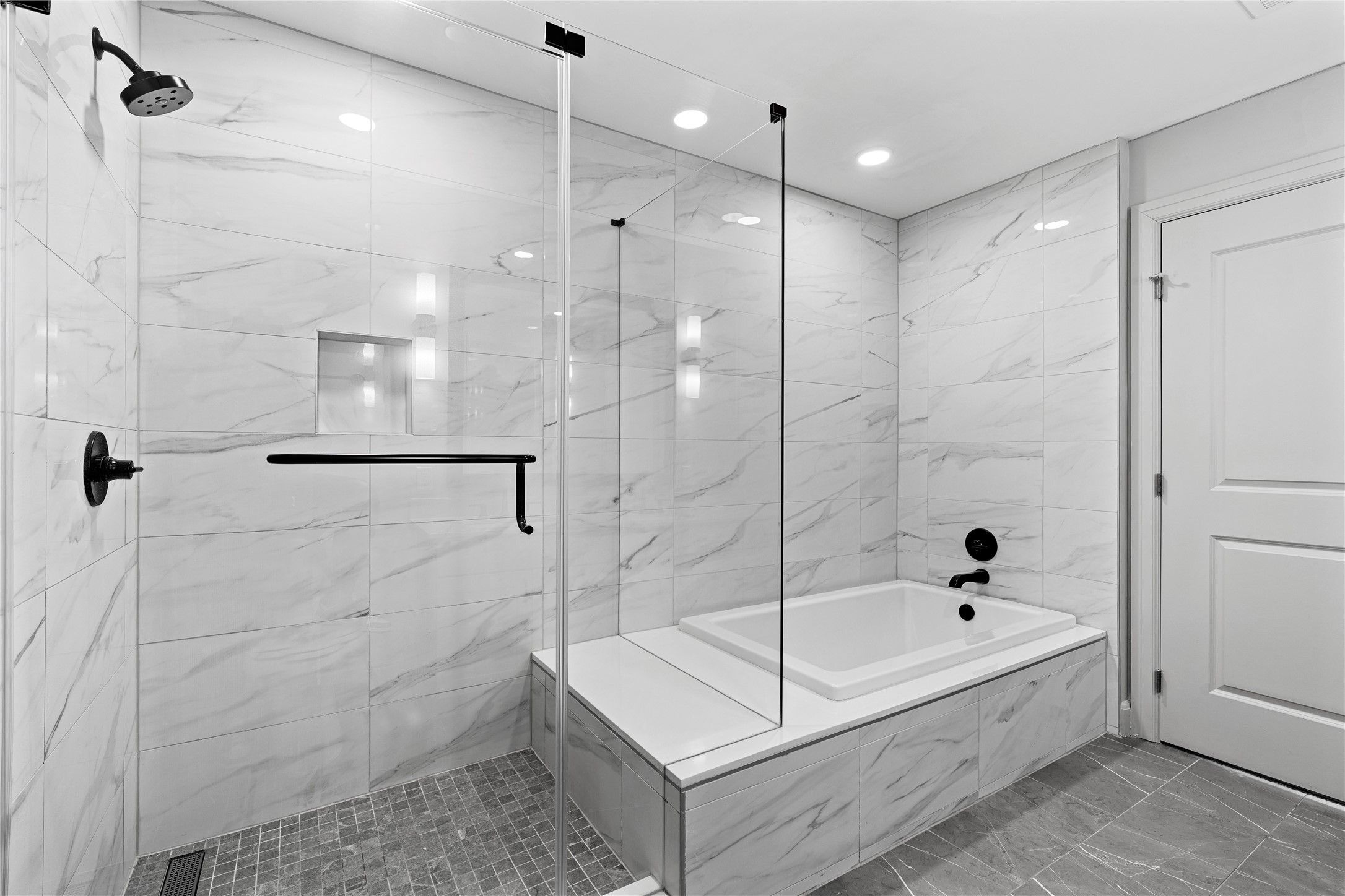 2511 Willowick Road, Unit 117 Houston, TX 77027 - Photo 19 of 43 a bathroom with a bathtub and a shower