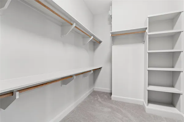 a view of an empty walk in closet